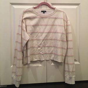 Cream colored sweatshirt with colorful stripes